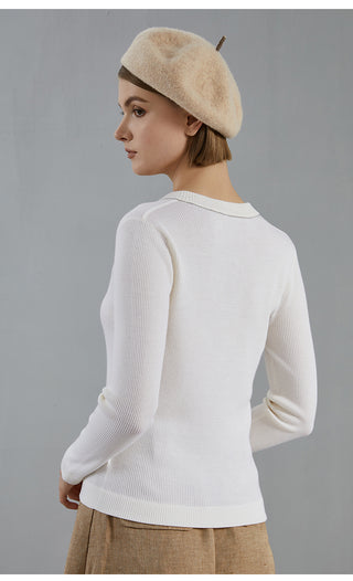 White wool knit top, side view with ribbed V-neck and long sleeves