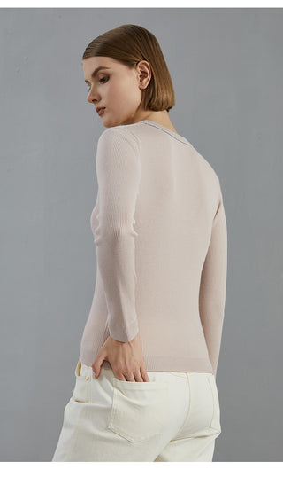 Pale taupe wool knit top, back view with long ribbed sleeves