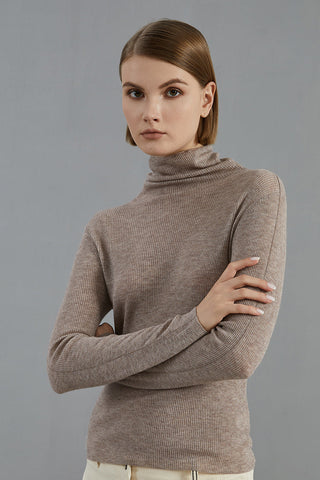 Dark camel ribbed turtleneck sweater with long sleeves and fitted silhouette