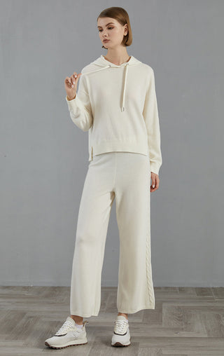 White wide-leg knit pants with easy waist and long, loose leg silhouette