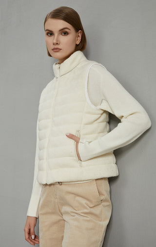 Side view of white wool puffer vest jacket with quilted panels and zip front