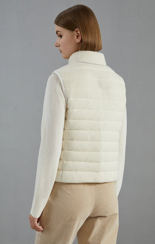 White back view of wool puffer vest jacket with quilted panels and stand collar