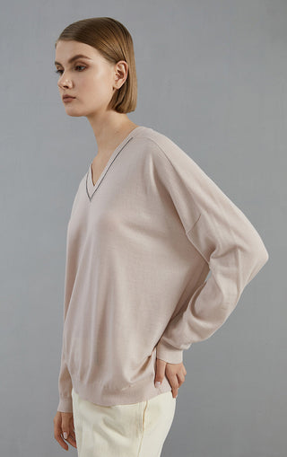 Pale taupe wool V-neck knit pullover side view with beaded neckline trim