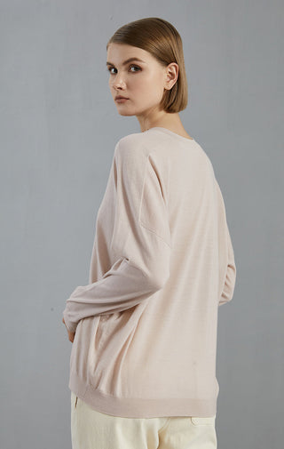 Pale taupe wool V-neck knit pullover back/side view, long sleeves and hem