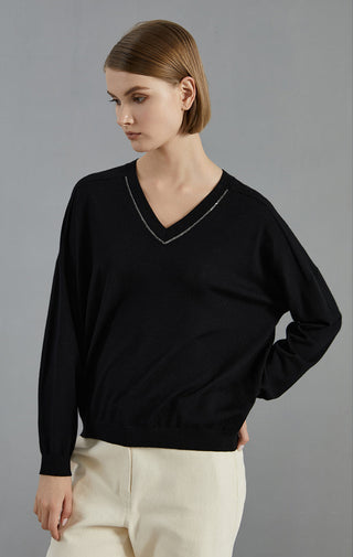 Black wool V-neck knit pullover with beaded collar detail at neckline