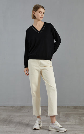Black wool V-neck knit pullover with beaded collar, relaxed fit and cuffs