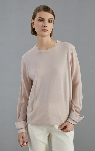 Pale taupe knit pullover with crew neckline and beaded cuff detail on sleeves.