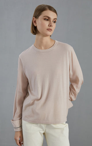 Pale taupe crewneck knit pullover; beaded cuff trim at relaxed 3/4 sleeves.