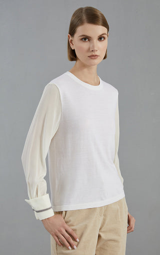 White wool-blend knit pullover with crew neckline; beaded cuff trim on sleeves.