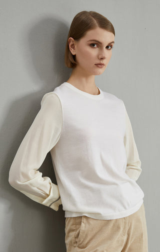 White wool-blend knit pullover, side view; beaded cuff trim at sleeve cuffs.