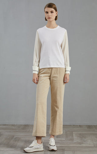White wool-blend knit pullover with crew neck; beaded cuff trim, long sleeves.