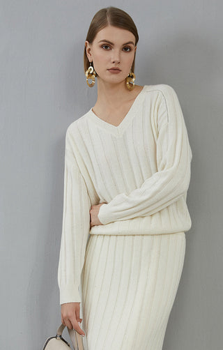 White cashmere V-neck ribbed sweater in side profile, long sleeves and vertical knit stripes