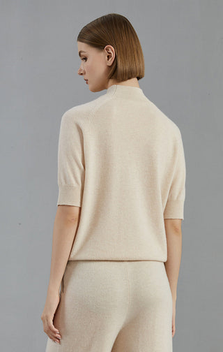 Back view: pale taupe cashmere short-sleeve knit sweater with ribbed cuffs