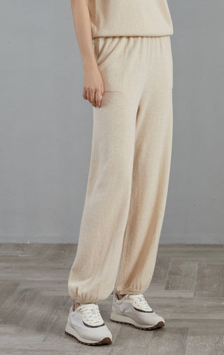 Apricot cashmere wide-leg lounge pants, side view, relaxed fit and elastic waistband
