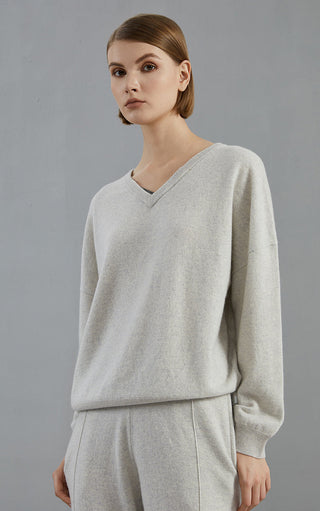 Light gray v-neck cashmere sweater, relaxed fit with ribbed cuffs and hem
