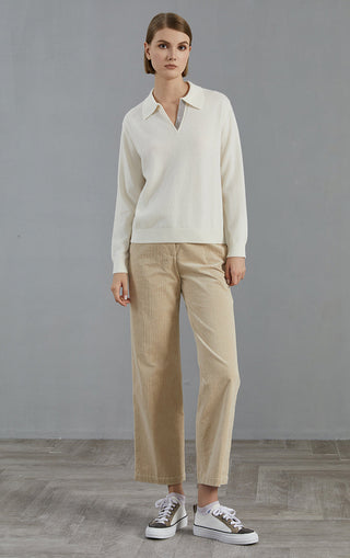 White collared knit top with beaded V-neck detail and ribbed hem