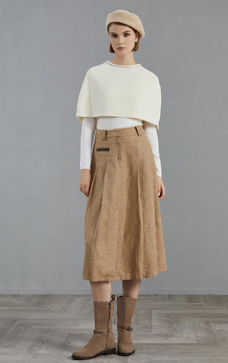 White wool knit poncho with ribbed crew neck, front view with short cape drape