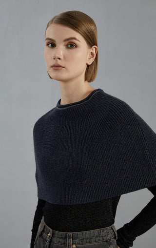 Dark gray wool knit poncho with ribbed crew neck, close side angle