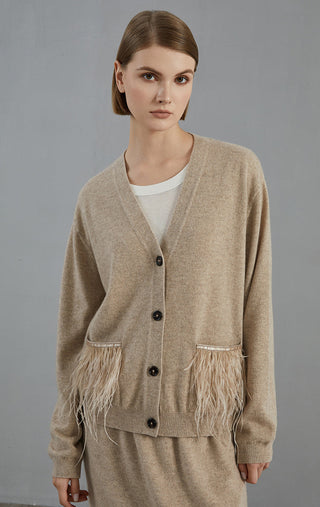 Camel V-neck cardigan with black buttons and feather fringe trim on sleeve cuffs