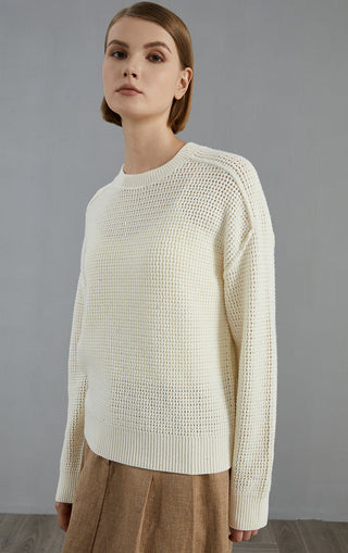 Camel open-mesh wool knit pullover in textured open stitch; crew neck and long sleeves