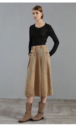 Black wool-blend knit pullover with long sleeves and beaded crew neckline, full view