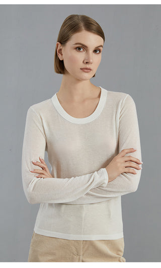Ivory long-sleeve knit pullover, crew neck, arms crossed front view