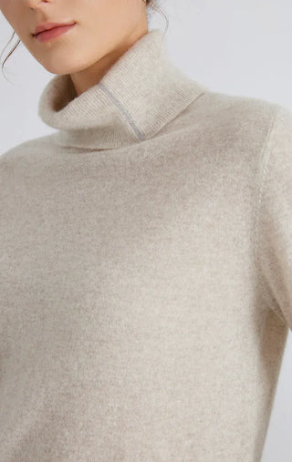 Light gray turtleneck sweater close-up of soft knit and ribbed neckline