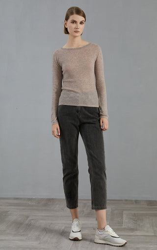 Purplish brown long-sleeve ribbed knit sweater worn with dark trousers, crew neck.