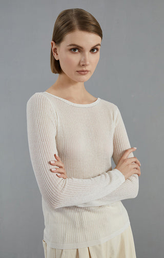 White ribbed knit sweater with crew neck and long sleeves, fitted silhouette.