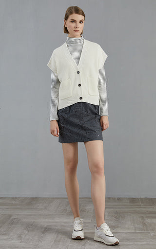 Ivory V-neck ribbed knit cardigan with button front and front patch pockets, casual fit