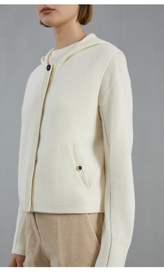 White wool hooded vest coat close-up of hood, button tab pocket, and front buttons
