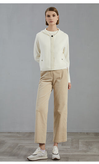White wool hooded vest coat worn with matching pants; button front and side pockets