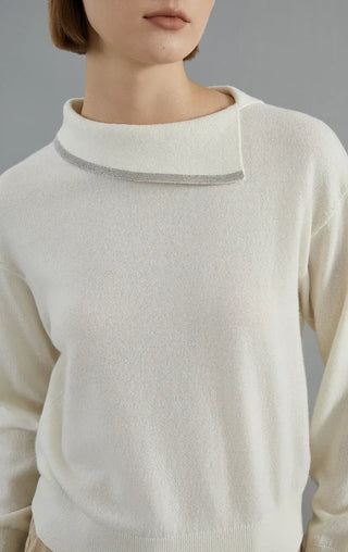 Ivory white cashmere pullover close-up of beaded collar trim around crew neck