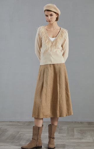 Apricot cashmere cardigan with feather trim at neckline and front, button closure
