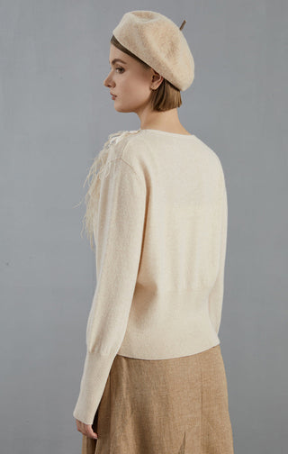 Apricot feather-trim cashmere cardigan back view, long sleeves, ribbed knit hem