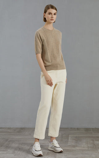 Camel cashmere short-sleeve sweater with crew neck, worn with light pants