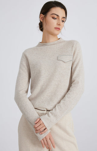 Light gray cashmere knit crewneck top with long sleeves and stitched silver chain pocket
