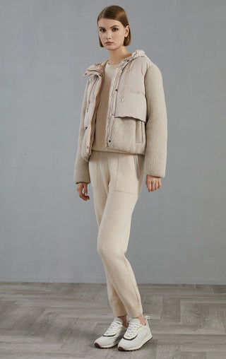 Camel hooded down jacket with wool-knit sleeves and drawstring hood; full-body view