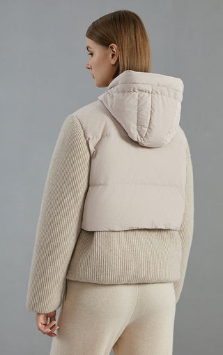 Camel hooded down jacket back view with ribbed knit sleeves and quilted center panel