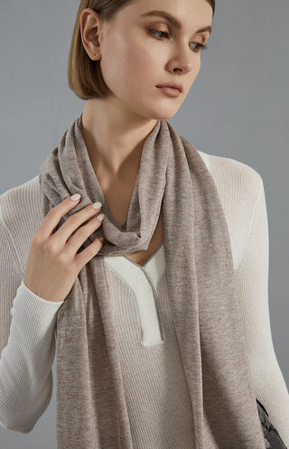 Taupe-brown wool-blend scarf close-up, soft weave and fringed border at neckline