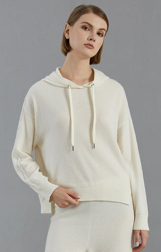 White cashmere hooded sweater with drawstring; ribbed hem and cuffs; knit sleeve detail