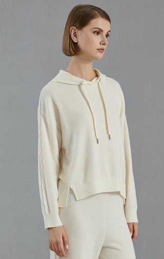White hooded cashmere sweater, side view; drawstring hood and ribbed cuffs