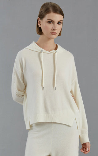 White cashmere hooded sweater, front view; drawstring hood and ribbed hem
