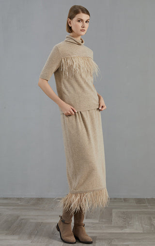 Camel two-piece look: high-neck short-sleeve sweater with fringe hem and skirt-like overlay