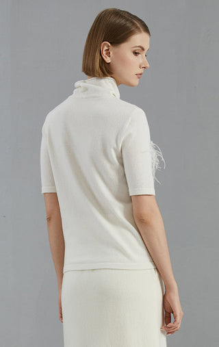 White cashmere high-neck short-sleeve sweater, back view; smooth knit panel seam