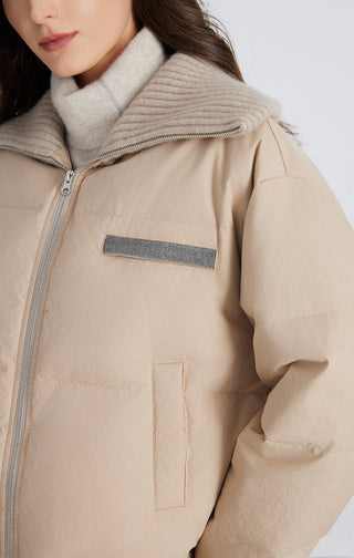 Camel cashmere down jacket close-up of chest patch pocket and knit collar trim