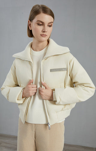 White cashmere down jacket front view with knit cuffs and center zip closure