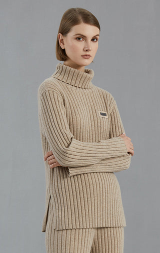 Camel ribbed turtleneck sweater, long sleeves, small rectangular beaded logo on chest
