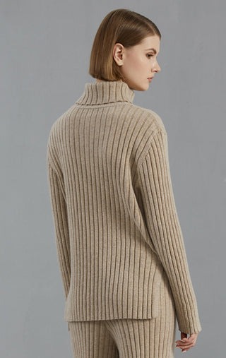 Camel ribbed turtleneck sweater, back view with logo patch on upper back
