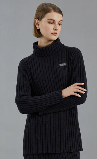 Dark charcoal ribbed turtleneck sweater with logo patch and long sleeves